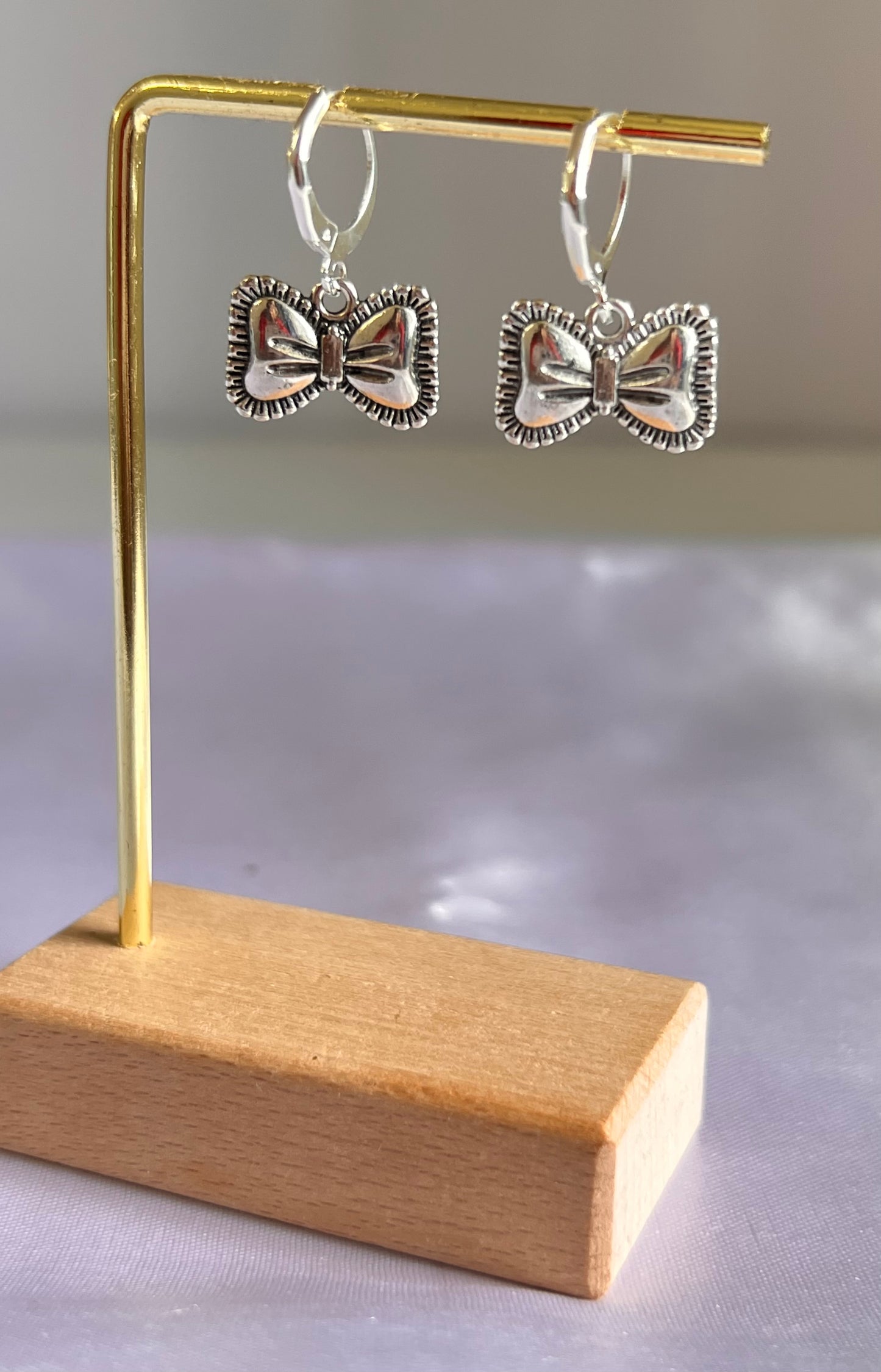 Tiny Twinkle Bow Hoops Earrings