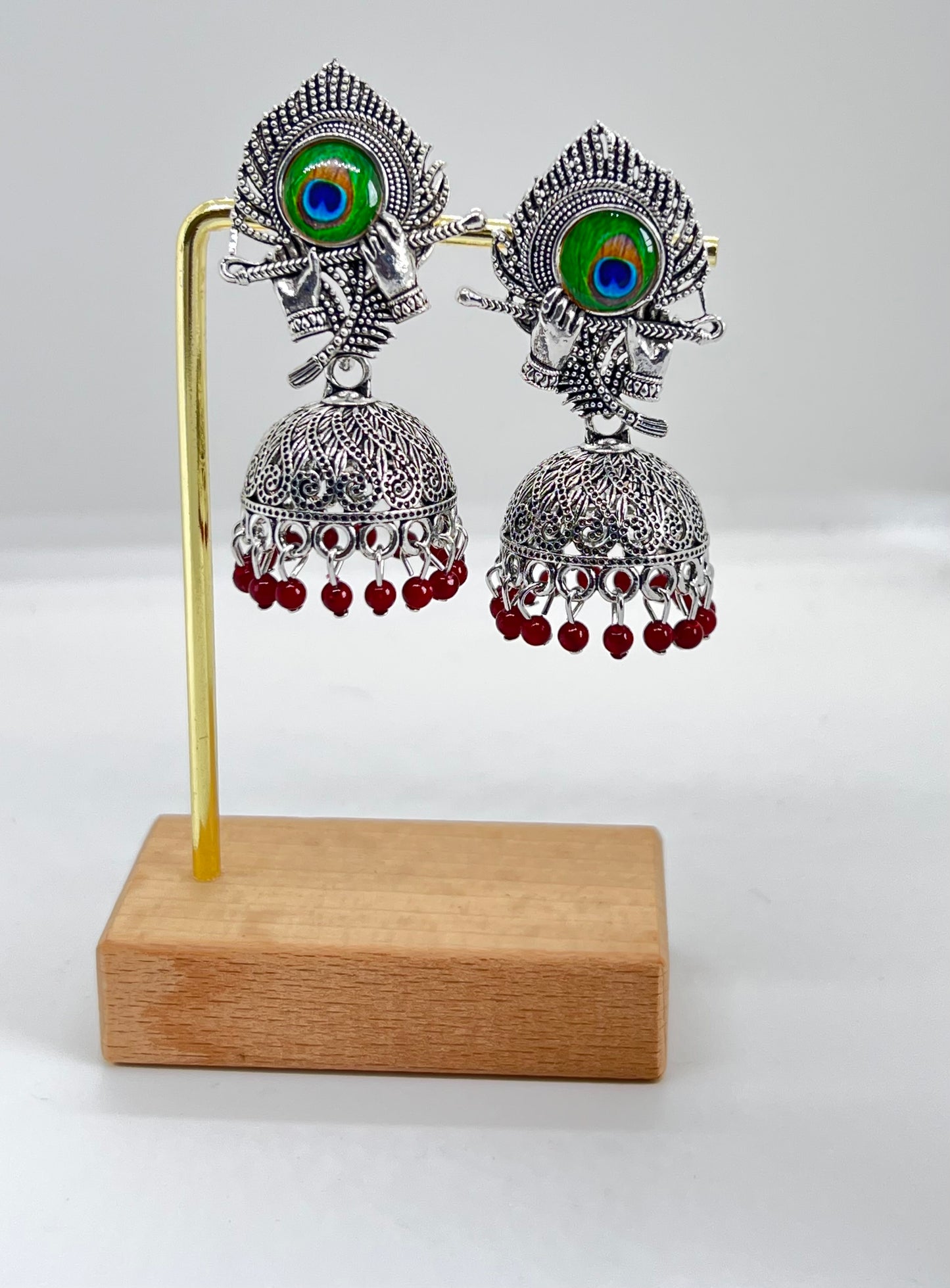 Divine Melody Peacock Jumka Earrings - Maroon